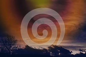 A sunset with dramatic clouds and a circle of light in the sky