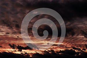 A sunset with dramatic clouds in the sky