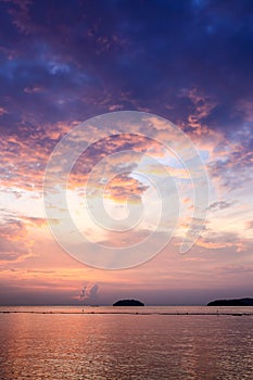 Sunset with dramatic clouds on the tropical beach