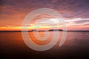 Sunset with dramatic clouds on the tropical beach