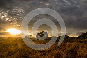 Sunset at Dusk over grassland valley