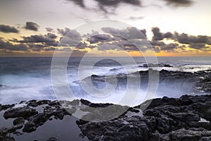 Sunset at El Bufadero natural blowhole on Gran Canaria. Ocean waves hiting rocks