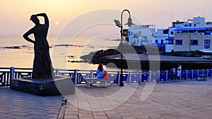 Sculpture of a woman looking out towards ocean in El Cotillo, Fuerteventura, Canary Islands, Spain