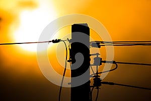 Sunset and Eletricity line and electricity post