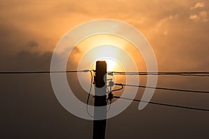 Sunset and Eletricity line and electricity post