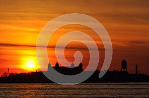 Sunset on Ellis Island in NYC bay