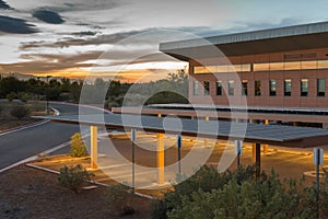 Sunset at empty parking lot with reflection on the mirrors