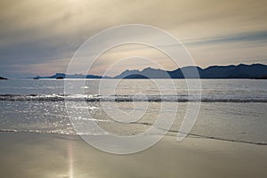 Sunset on the empty Roervik beach, Norway