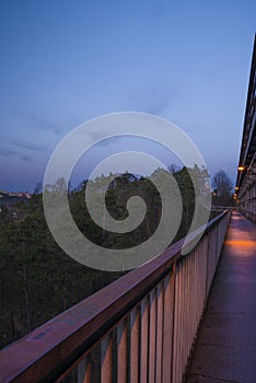 Sunset evening on foot and railway bridge over valley in Trebic town