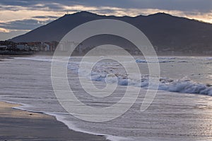 Sunset evening walk on hendaye beach, basque country, france