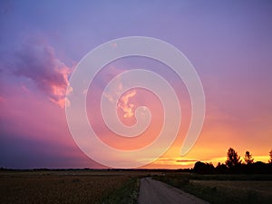 Sunset in fields of cut grain