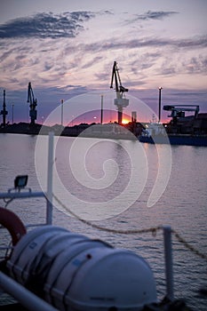 Sunset in Finland. Bulk port. White nights in Bothnia Sea. North of Finland. Summer time. Midnight photo
