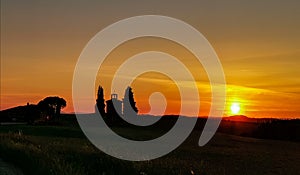 Sunset on fire at little Chapel of Vitaleta in Tuscany