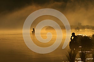 Sunset fishing in fog