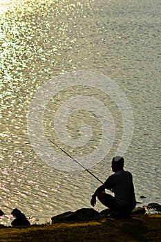 Sunset fishing silhouette