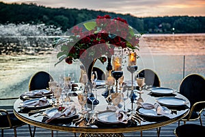 Sunset. Flowers. Candles. Wedding decoration. Floral arrangements