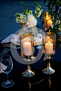 Sunset. Flowers. Candles. Wedding decoration. Floral arrangements