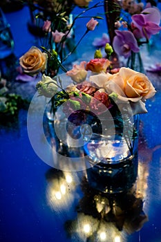 Sunset. Flowers. Candles. Wedding decoration. Floral arrangements