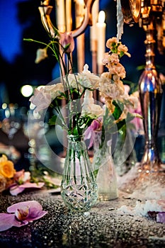 Sunset. Flowers. Candles. Wedding decoration. Floral arrangements