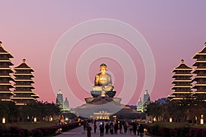 Sunset at Fo Guang Shan buddist temple of Kaohsiung, Taiwan with many tourists walking by. photo