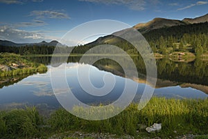 Sunset at a forest lake in Colorado