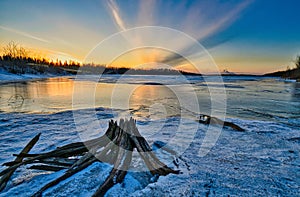 Sunset on the frozen ice Mildred  lake north of Fort McMurray  Alberta