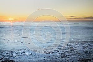 Sunset on the frozen lake