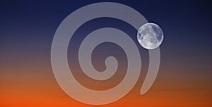 Sunset and Full Moon at Sunset or Sunrise on Horizon Orange and Blue Light