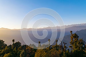 Sunset in Garhwal Himalayas during autumn season from Deoria Tal camping site.