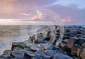 Sunset with the Giant`s Causeway in the foreground