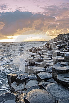 Sunset with the Giant`s Causeway in the foreground