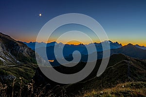 Sunset at the Giau pass in the dolomites near Cortina in fall.