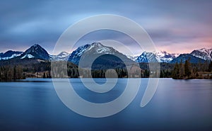 Sunset about glacial lake named Strbske Pleso in National Park H