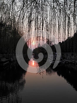 The sunset glow is reflected in the spring at dusk