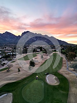 the sunset glows on the beautiful golf course at desert ridge golf club