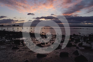 Sunset goes down over a jetty