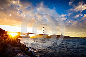 Sunset at the Golden Gate Bridge with sun starburst