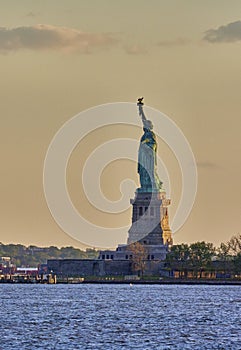 Sunset Golden hour night photography of the statue of Liberty from the Battery Park New York City