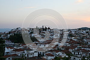 Sunset in greek city, panoramic view of the houses