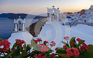 Sunset at the Greek village of Oia Santorini Greece with a view over the ocean caldera