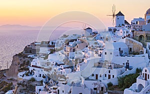 Sunset at the Greek village of Oia Santorini Greece with a view over the ocean caldera