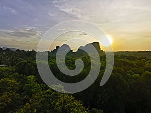 Sunset at green mountain hill in mangrove forest in nature forest at Krabi at Krabi, Thailand.