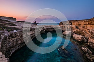 Sunset at the Grotta della Poesia Roca Vecchia (Salento, Italy)