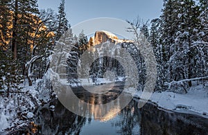 Sunset at Half dome reflected in the merced rivier