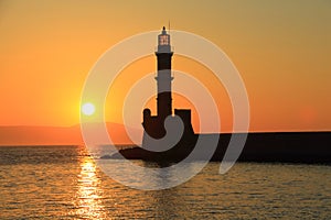 Sunset at harbor with lighthouse Chania Crete