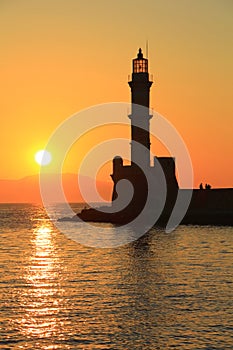 Sunset at harbor with lighthouse Chania Crete