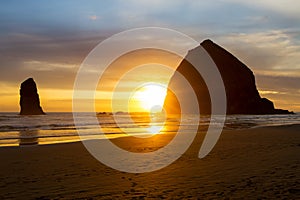 Sunset by Hastack Rock at Cannon Beach along Oregon coast