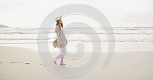 Sunset, hat and happy woman on beach walking for summer vacation, outdoor travel and tropical island. Relax, journey and