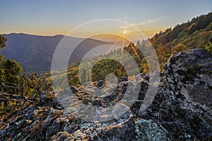 Sunset at Havranie skaly rocks over Hrochotska dolina valley