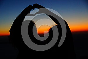 Sunset hearts in Santorini Magic Island in Greece